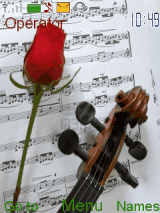 Violin with rose and music sheets